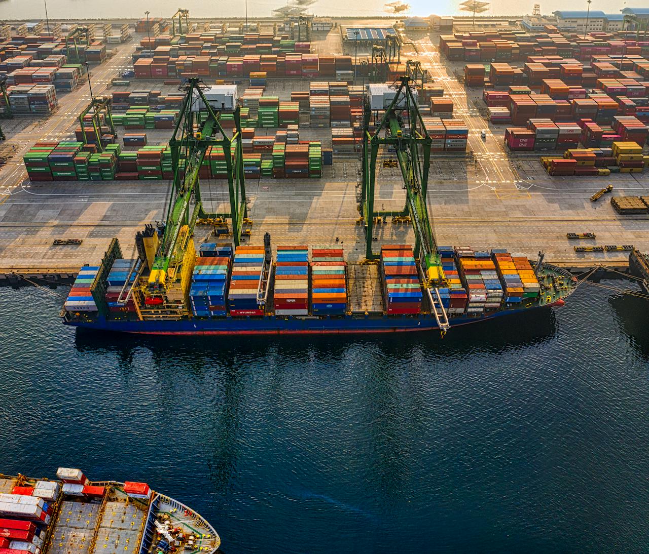 services-02 Aerial shot of colorful shipping containers at North Jakarta's bustling port, Indonesia.