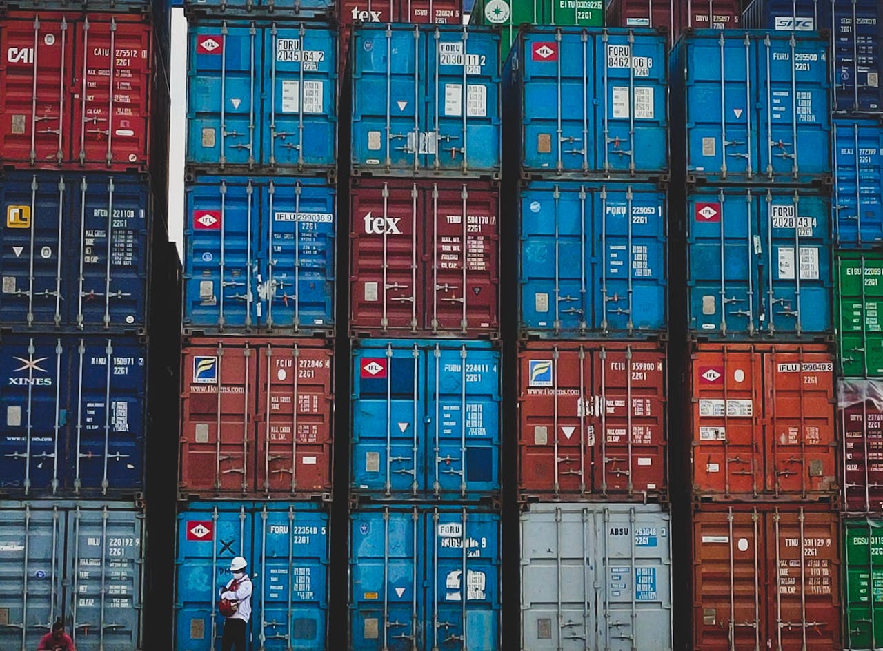 about-us Colorful stacked cargo containers at a shipping yard in Jakarta, Indonesia.